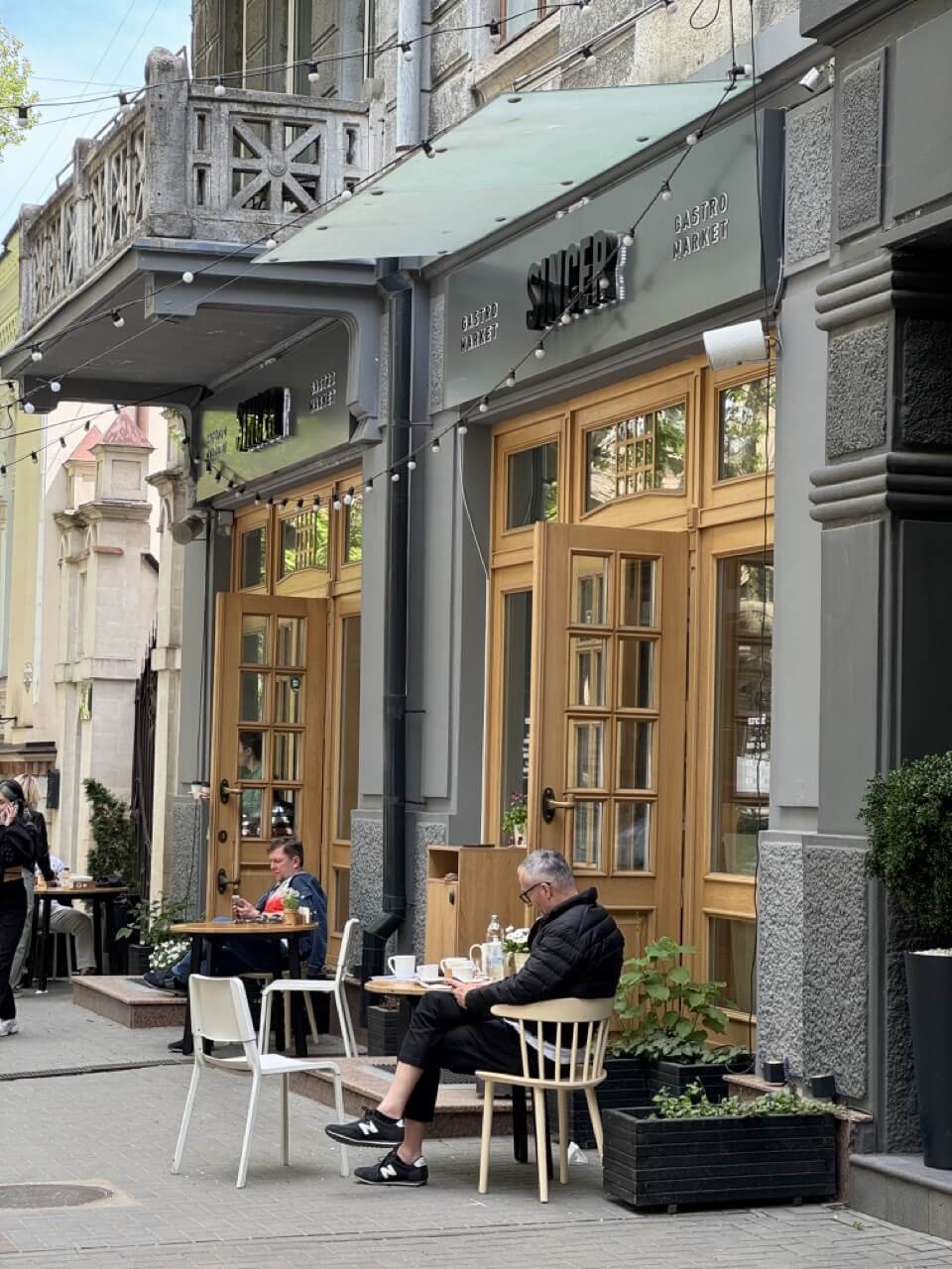 People sitting on the terrace of Sincer cafe in Chisinau